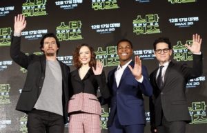 Actor Adam Driver, left, actress Daisy Ridley, second from left, actor John Boyega, second from right, and director J.J. Abrams pose for the media during a press conference for their new movie "Star Wars: The Force Awakens," in Seoul, South Korea, Wednesday, Dec. 9, 2015. The movie is to be released in South Korea on Dec. 17. (AP Photo/Lee Jin-man)