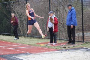  Cotton jumps into the sand pit while competing the long jump during her sophomore year track season. Cotton was not able to compete the next season due to an injury to her ACL the next year. 