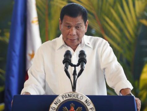 Philippine President Rodrigo Duterte addresses the crowd during a news conference prior to boarding his flight for a three-day official visit to Japan at the Ninoy Aquino International Airport in suburban Pasay city, south of Manila, Philippines, Tuesday, Oct. 25, 2016. Duterte lashed out anew at the United States following Monday's interview with U.S. Assistant Secretary of State for East Asian and Pacific Affairs Daniel Russel who said that Duterte's controversial remarks and a "real climate of uncertainty" about the government's intentions have sparked consternation in the U.S. and other governments and in the corporate world. (AP Photo/Bullit Marquez)