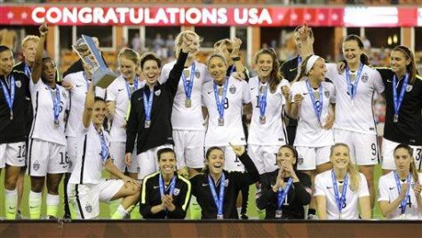 The U.S. Women's soccer team celebrates after winning the CONCACAF Olympic women's soccer qualifying championship final against Canada Sunday, Feb. 21, 2016, in Houston. The U.S. won 2-0. (AP Photo/David J. Phillip)