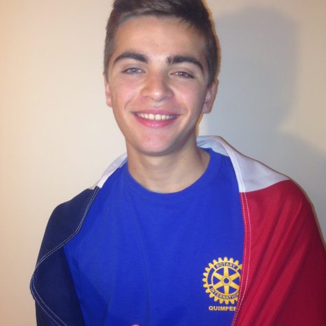 Théo Nunes, Rotary exchange student from France, poses with his French flag after sharing his ideas about what teenage drinking in France is like. Nunes came the Unites States during mid August. (Broadcaster/Moxie Thompson )