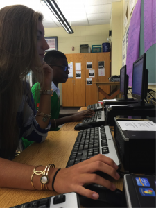 Journalism II students, Elma Abdic and Brandon Hill, work on their online articles during class on Monday, September 21. As the articles are finished, they will be published on The Broadcaster website. 