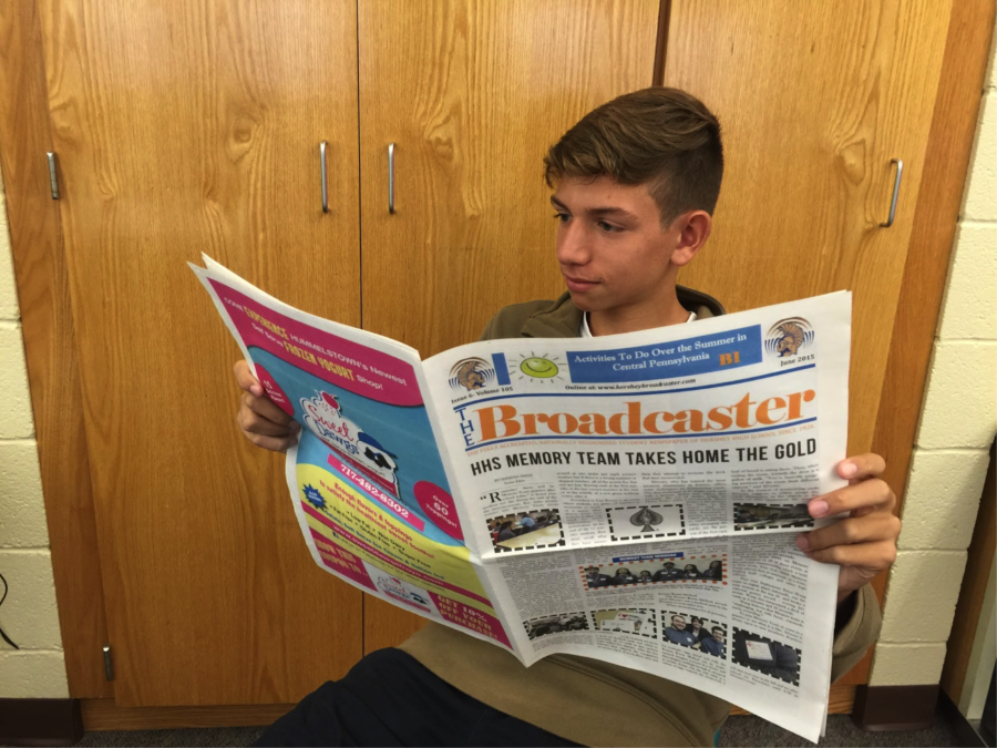 Henry Isaacson, sophomore, enjoys a vintage copy of The Broadcaster on Monday, September 21. Isaacson read this old copy for inspiration for his own stories.