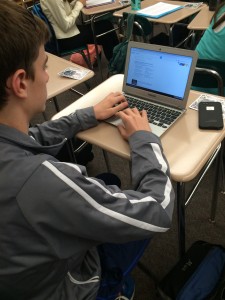Max Geeting a sophomore at HHS works on his English project in Crowley's class during first period on Friday, Oct. 2, 2015. Everyone in class that day had to work on a project about dystopian society. Students had a choice of using technology or working on a poster.