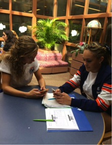 Bella DAdderio, right, sophomore at HHS and Burston-Green, left, are in the library at HHS  Friday, Sep. 25, 2015. DAdderio helped Burston-Green make online flashcards of her Acedemic Literacy vocab list. 
