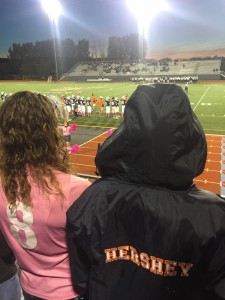 From left, HHS seniors Delaney Price and Grace Miller cheer on their team, Saturday at MIlton Hershey.