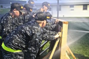 The Constellation Division Cadets participate in a simulation on June 11, 2015. In this simulation, the cadets were working together to plug holes in the wall with rubber for teamwork.
