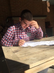HHS Young Democrats member junior Eric Krieger makes a phone call to a local registered voter on behalf of Sandy Ballard’s Supervisor campaign on Tuesday, November 3rd, 2015 outside of the Ballard campaign headquarters in Hershey, PA. 15 HHS Young Democrats members spent election day campaigning for Ballard at the polls and making phone calls in support of her campaign. 