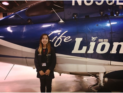 Mailan Dang stands in front of the Life Lion helicopter at the Penn State Hershey Medical Center. Dang is a senior at Hershey High School and participates in HCEP. 