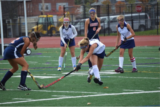 Alexis Gazzio (left) fights back to get the ball from 
Dallastown opponent. Lauren Lechleitner(middle) defends
anticipating the next move.
