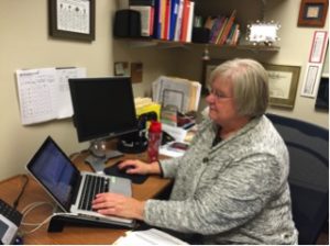 Mrs. Good, HHS counselor, sits in her office viewing student transcripts on October 28th, 2015. Good counsels approximately 300 students a year in ways ranging from standardized tests to college applications.