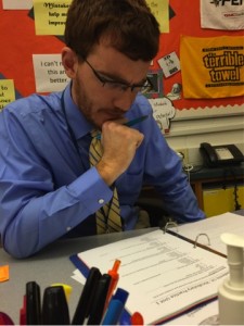 Derek Dietz, a new English teacher at HHS, looks over Academic Literacy plans on Thursday, October 29th. Dietz helped the students forming Sitcom club navigate through the guidelines. 
