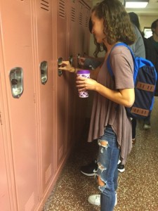 Kate Zurlo, on October 13 2015, is standing at her locker at the end of the day; she is the current co-president of Young Democrats and the leader in their new recycling program. 