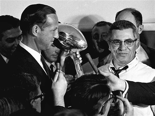 In this Jan. 15, 1967,  file photo, football commissioner Pete Rozelle, left, presents the trophy to Green Bay Packers coach Vince Lombardi after they beat the Kansas City Chiefs 35-10 in Super Bowl I in Los Angeles.  (AP Photo, File)