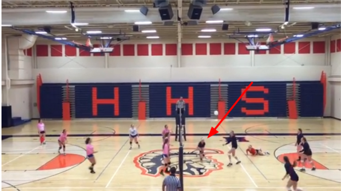 Hershey High School Sophomore Lilly Strader, indicated by the red arrow, takes a hard smack to the ground while playing in the Varsity volleyball game against Lower Dauphin High school on October eighth. Four days later Strader was diagnosed with a concussion.