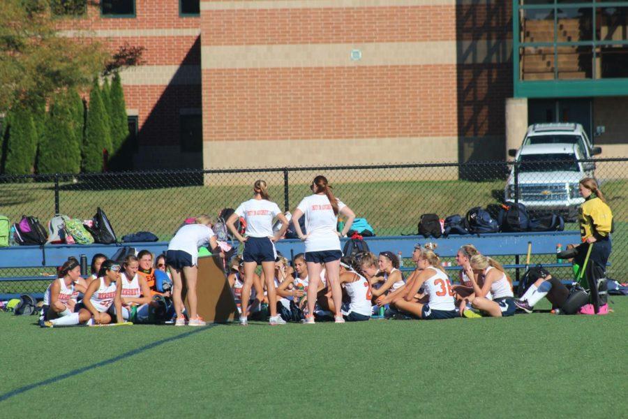 The team listens in as the coach explains a new strategy using the whiteboard. It’s this kind of player coach communication that the players cite as the reason for their success 
Photo courtesy of Cate Hottenstein    
