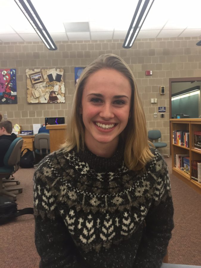 Caroline Sinz, currently an HHS junior, poses for a photo in the high school library on January 11th, 2016. Sinz reminisced about her school year abroad in Spain her sophomore year. 