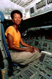 Dr. Mae C. Jemison, the first black female to become an astronaut candidate, sits in the commander's seat aboard a Space Shuttle trainer at the Johnson Space Center in Houston, Texas, Aug. 24, 1987. (AP Photo)