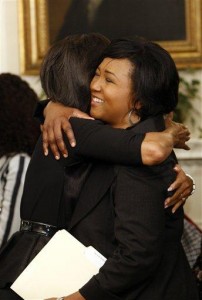 First lady Michelle Obama, left, hugs former NASA Astronaut Mae C. Jemison, right, as she welcomes guests to the Diplomatic Room of the White House in Washington, Thursday, March 19, 2009, as she hosted a series of events in celebration of Women's History Month. Twenty-one women at the top of their fields will join the first lady in visiting local schools and speaking with students about their career goals. (AP Photo/Pablo Martinez Monsivais) 