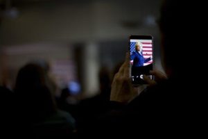 A woman uses her smartphone to photograph Democratic presidential candidate Hillary Clinton as she speaks during a rally on the campus of Simpson College, Thursday, Jan. 21, 2016, in Indianola, Iowa. (AP Photo/Jae C. Hong) 