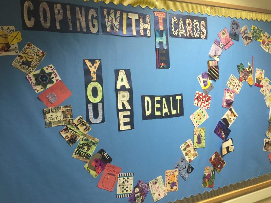 A poster reading “Coping With the Cards You Are Dealt” gives young people’s perspectives of coping and handling their disorders. It was worked on by a number of patients to reassure them that they have support and will get better in a matter of time. Taken on November 2, 2015 in the Briarcrest Adolescent Medicine. 
