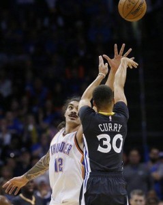 Golden State Warriors guard Stephen Curry (30) shoots over Oklahoma City Thunder center Steven Adams (12) in the fourth quarter of an NBA basketball game in Oklahoma City, Saturday, Feb. 27, 2016. Golden State won 121-118 in overtime. (AP Photo/Sue Ogrocki) 