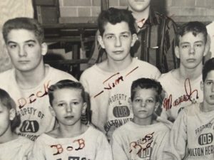 Gould (bottom left) and his wrestling team. Gould loved his wrestling team, but becoming JV captain was too much responsibility for him, he said. 