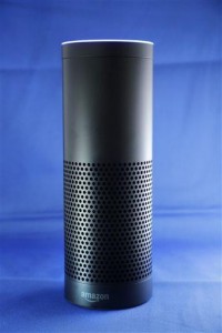 Amazon's Echo, a digital assistant that can be set up in a home or office to listen for various requests, such as for a song, a sports score, the weather, or even a book to be read aloud, is shown, Wednesday, July 29, 2015 in New York. The $180 cylindrical device is the latest advance in voice-recognition technology that's enabling machines to record snippets of conversation that are analyzed and stored by companies promising to make their customers' lives better. (AP Photo/Mark Lennihan) 