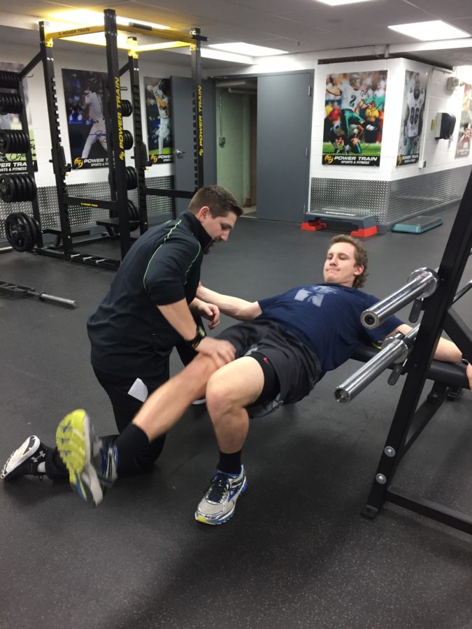 Performance Coach, Dustin Arnold, trains Hershey High School senior, Karl Vanblargan, on Friday, February 19th, 2016, during one of his weekly sessions at Power Train.