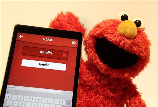 In this Monday, Feb. 15, 2016, photo, Love 2 Learn Elmo is shown with a personalized iPad app from Hasbro at Toy Fair in New York. (AP Photo/Mark Lennihan)
