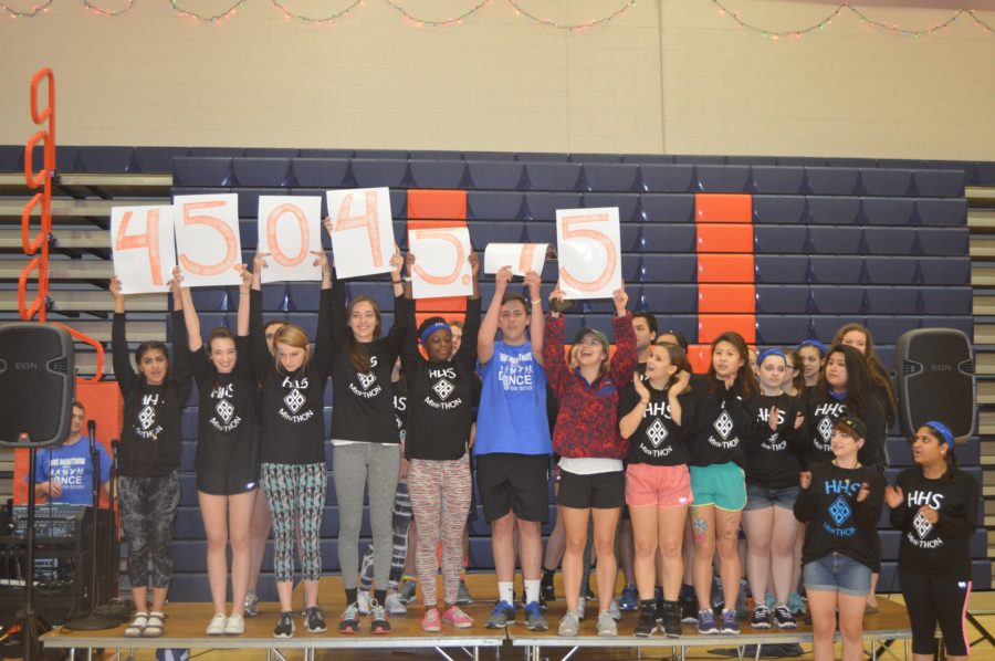 HHS miniThon members hold up the total amount of money raised. Hershey High raised $45,045.45 this year, $7,000 more than in 2015. 
