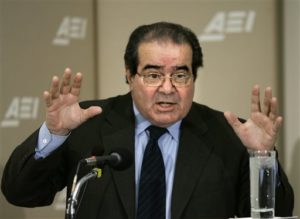 In this Feb. 21, 2006 file photo, Supreme Court Justice Antonin Scalia gives the keynote speech on the debate over the role that international and foreign law should play in American judicial decision-making, during a day-long symposium at the American Enterprise Institute in Washington. Dow Chemical says it will pay $835 million to settle a long-standing class action lawsuit, after the death of Scalia decreased its chances of prevailing at the Supreme Court. The company was found liable in 2013 by a Kansas jury of allegedly conspiring to fix prices for polyurethane, an industrial chemical. Dow had petitioned the Supreme Court to reconsider the judgment. (AP Photo/J. Scott Applewhite, File) 