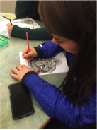 Sophomore Lauren Kroutch colors a picture of a tiger on April 29, 2016. She was very focused in completing her design. (Broadcaster/Kaitlin Christ) 