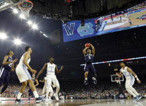 Villanova's Phil Booth (5) shoots during the first half of the NCAA Final Four tournament college basketball championship game against North Carolina, Monday, April 4, 2016, in Houston. (AP Photo/David J. Phillip)