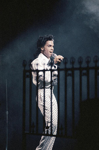 American pop star Prince sings at the beginning of his second concert around July 10,1988 at Paris Bercy stadium, where he began his "Lovesexy" world tour.(AP Photo/Pierre Gleizes)