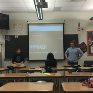 Juniors, Maggie Lane and Max Dadswell, explain Sitcom Club to fellow junior, Haley Terharr. Lane and Dadswell were in charge of running the Sitcom Club Session at Hershey High School's first ever Community Day on April 29th, 2016. 