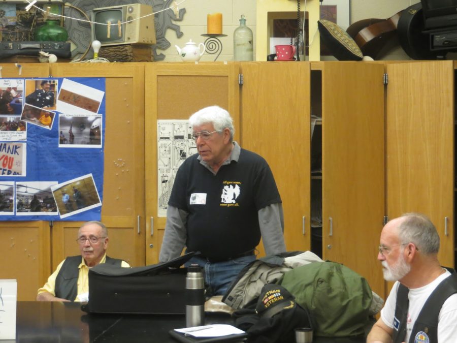 Frank Rowe (left) and Rich Burton (right) listen to Adley Eigen talk about his experiences in the Vietnam War on April 29, 2016. Adley explained how he had to know every part of the plane so he could fix it; he proudly said no C-130s he knew of failed due to mechanical problems.
