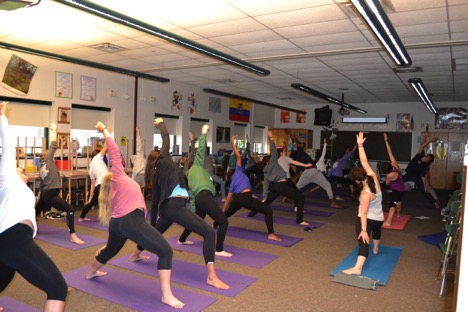 Students try a Vinyasa stretch known as Reverse Warrior Pose during the Power Vinyasa Yoga on Hershey High School’s Community Day. (Broadcaster/ Rachael Schirato)