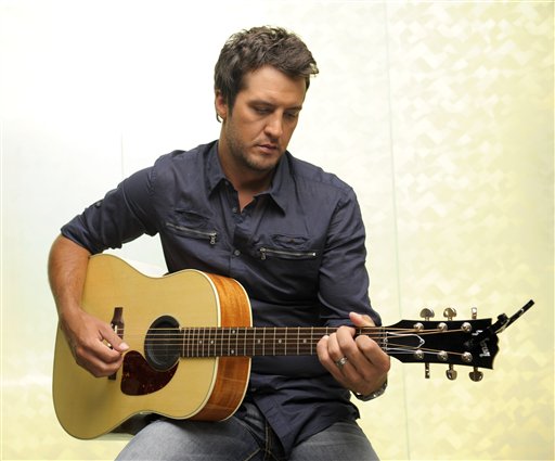 In this July 12, 2011 photo, country music artist Luke Bryan poses for a photo in Nashville, Tenn. Bryan released his third album Tailgates and Tanlines," (AP Photo/Donn Jones)