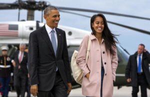 President Barack Obama jokes with his daughter Malia Obama as they walk to board Air Force One from the Marine One helicopter, as they leave Chicago en route to Los Angeles on Thursday, April 7, 2016. The White House announced Sunday, May 1, 2016, that Malia Obama will take a year off after high school and attend Harvard University in 2017. (AP Photo/Jacquelyn Martin, File)