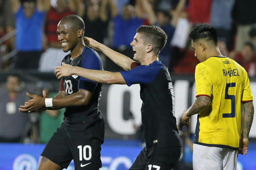United States Darlington Nagbe (10) and Christian Pulisic, center, celebrate Nagbes goal in front of Ecuadors Cristian Ramirez (5) during the second half of an exhibition soccer match, Wednesday, May 25, 2016, in Frisco, Texas. The United States won 1-0. (AP Photo/Tony Gutierrez)