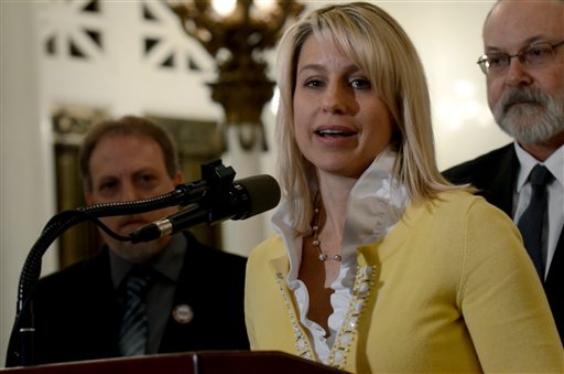 Christine Brann, of Hummelstown, speaks at a news conference in the Pennsylvania Capitol where she and other parents of children suffering from debilitating seizures urged the state House of Representatives to pass medical marijuana legislation, Wednesday, April 13, 2016, in Harrisburg, Pa. Branns son, Garrett, 5, suffers from a severe form of epilepsy known as Dravet syndrome.  Governor Wolf signed the bill. (AP Photo/Marc Levy)