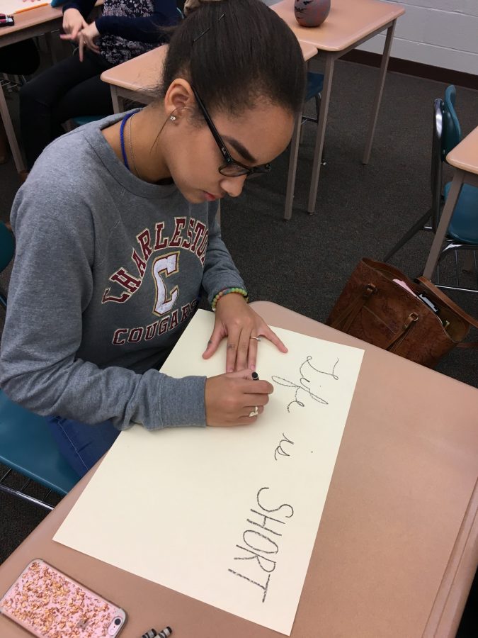 Junior Azelin Thompson creates an inspirational poster during the HCYA: Hershey Compliments session. Azelin has been a member of HCYA since the beginning of the school year. (Broadcaster/ Bella D’Adderio)