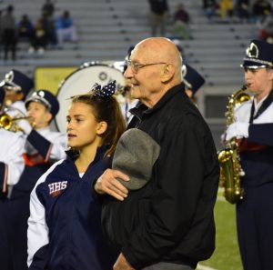 On Friday, September 30th, Edward Fornwalt, right, and senior Bella Flynn, left, pay homage to their high school during the HHS marching band performance of the Alma Mater.  (Broadcaster/Mallory Drayer) 