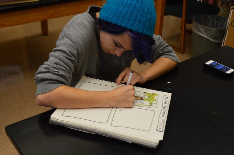 On October 7th, 2016, HHS had its annual Community Day. Pictured above, Jayden Solovey finishes up her drawing of the high school’s garden in the nature sketching session. (Broadcaster/ Madison Held)