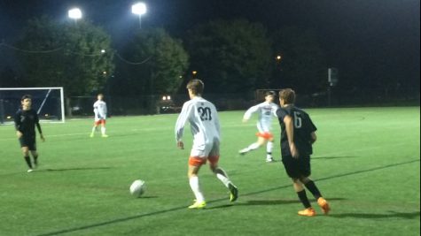 Hershey’s Dante Falcucci, center, dribbles the ball passed Mifflin defenders. The Trojans beat Mifflin County 5-0 on Tuesday, October 11, 2016. (Broadcaster/Rachael Schirato)