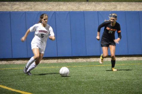 Star player of the night, junior, Lauren Epler, is taking control of the ball. Epler made three out of the four goals during the game. (Broadcaster/Azelin Thompson)