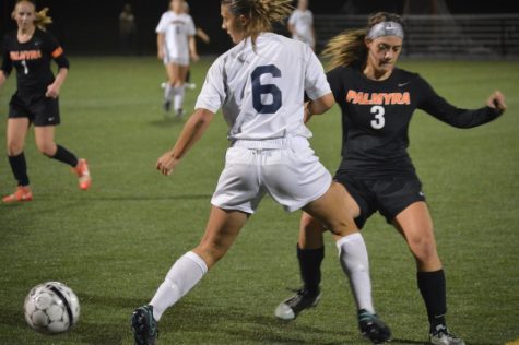 Junior, Mckenna Lewis keeps her eyes locked on the ball. She outsmarted her opponent and headed for the goal. (Broadcaster/Azelin Thompson)