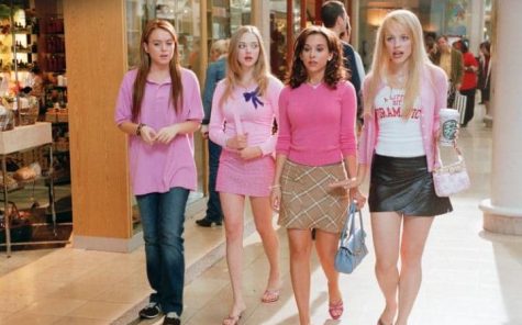 The Plastics chat while walking through a mall. On Wednesdays, they wear pink. (Image courtesy of Paramount Pictures)