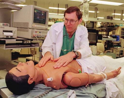 ADVANCE FOR SUNDAY JUNE 13--Dr. W. Bosseau Murray, director of the Simulation, Development and Cognitive Science Center at the Milton S. Hershey Penn States College of Medicine, displays a computerized dummy that simulates breathing and pulse in the Hershey, Pa. Medical Center Monday, June 7, 1999. Doctors, nurses, medical students and anesthesiologists use the dummy to learn how to deal with medical traumas without endangering patients.(AP Photo/Paul Vathis)